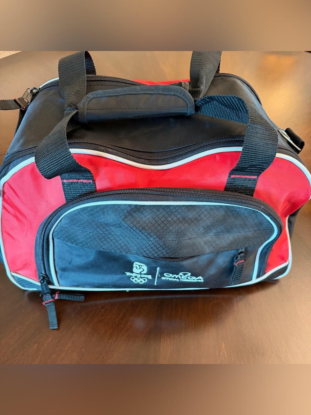 Omega Red and Black Men's Travel Duffel with Teal Trim